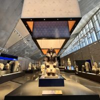 (241015) -- GIZA, Oct. 15, 2024 (Xinhua) -- This photo taken on Oct. 15, 2024 shows exhibits at an exhibition hall of the Grand Egyptian Museum in Giza, Egypt. The Grand Egyptian Museum on Tuesday announced trial operations of its Main Galleries, starting from Oct. 16, 2024, offering visitors an exclusive preview of twelve exhibition halls with artifacts spanning from prehistoric times to the Roman era. This trial phase is part of the museum's ongoing efforts to ensure a seamless visitor experience ahead of its official opening. (Xinhua/Sui Xiankai)